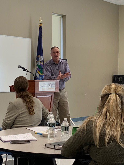 Workforce Development Specialist Doug Dunbar speaks to a group about removing barriers to people in recovery